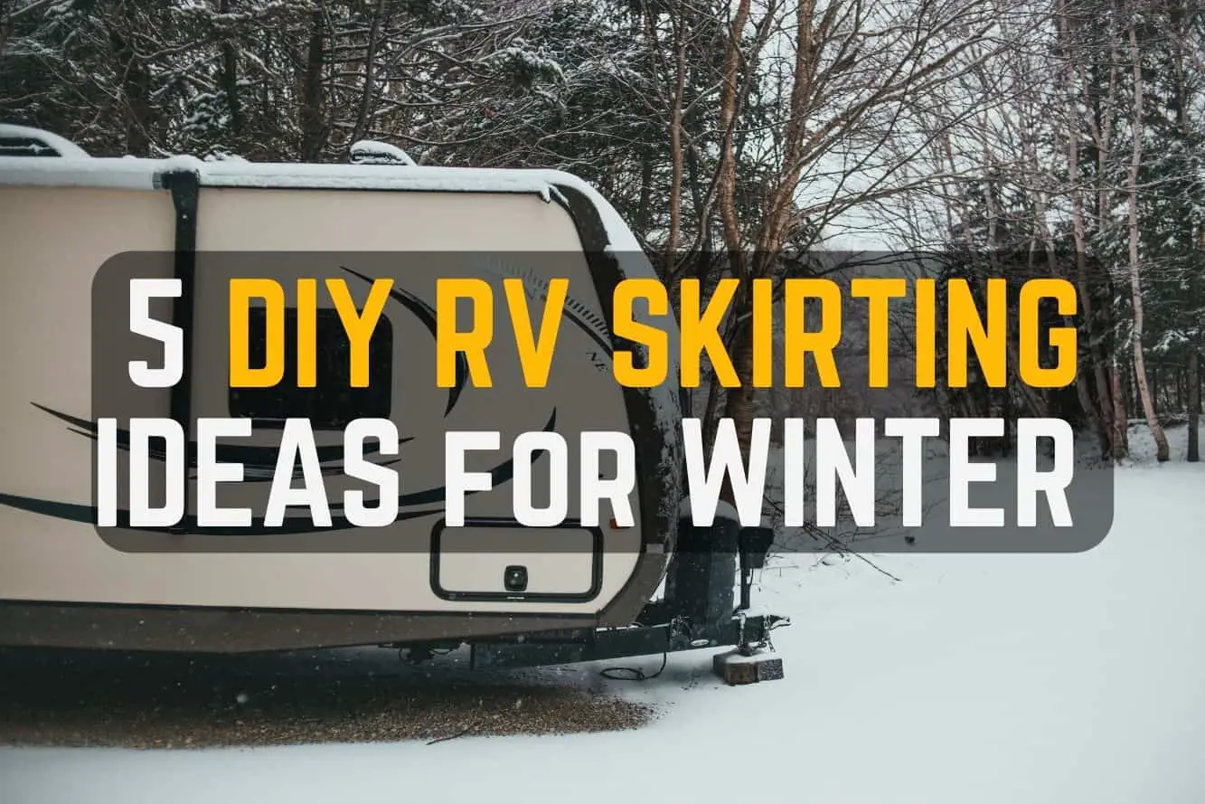 5 DIY RV skirting ideas for winter: image shows a travel trailer parked at a campground with snow on the ground and roof of the camper